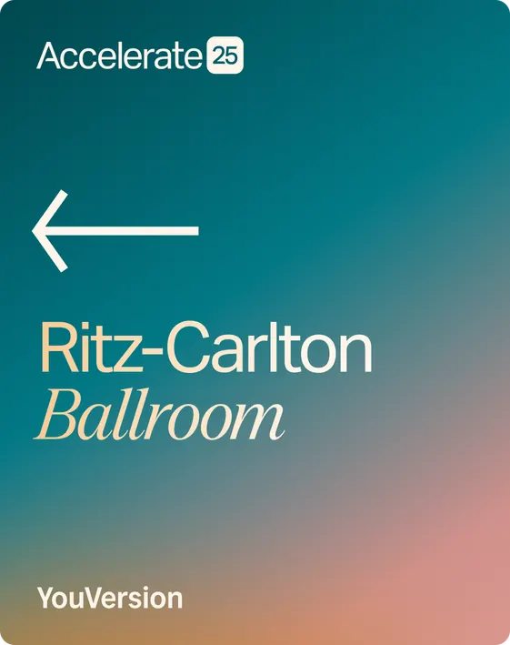 Accelerate 25 event signage on a teal-to-peach gradient: an arrow pointing left to the Ritz-Carlton Ballroom, with the YouVersion wordmark bottom-left.